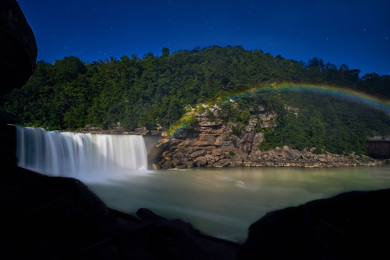 Rainbow is seen next to a beautiful waterfall in Kentucky.